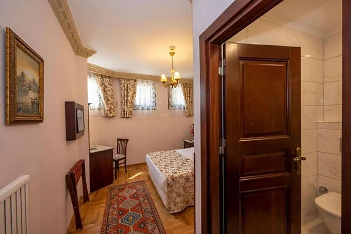 A simple, clean 3-star hotel room with a view over Sultanahmet rooftops