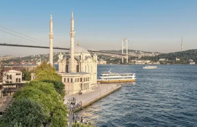 Ferries crossing the Bosphorus strait with the Istanbul skyline in the background