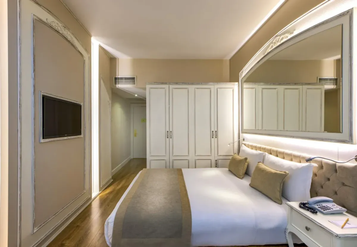 A boutique hotel courtyard with a view of Hagia Sophia's dome in the distance